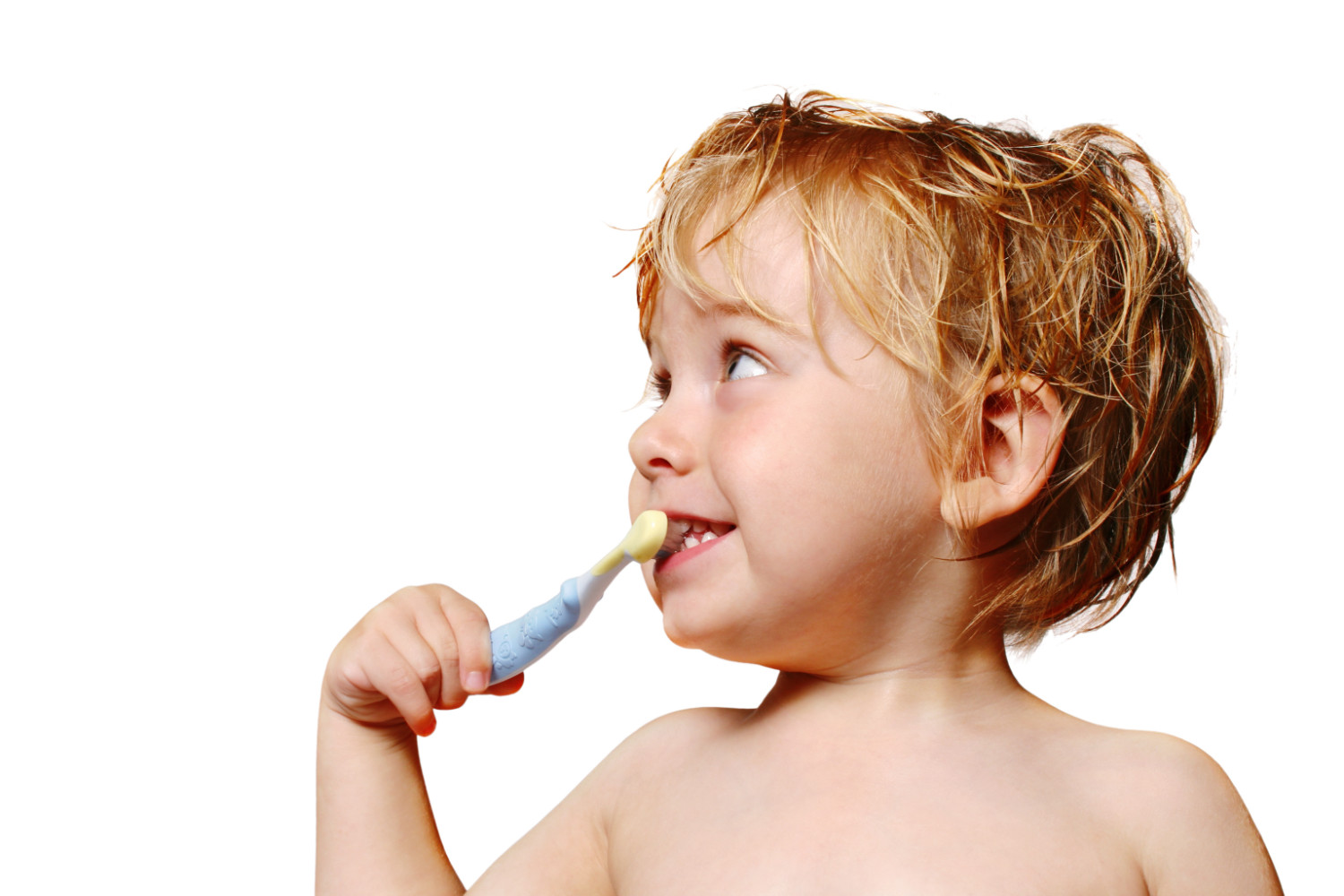 young boy brushing his teeth